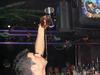 Oscar Perez at work at Kahunaville in T.I. - Oscar pours a drink into a glass balanced on top of a bar spoon balanced on his chin.