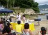 cesar in action - cesar giving many tips about flair bartending in the beach